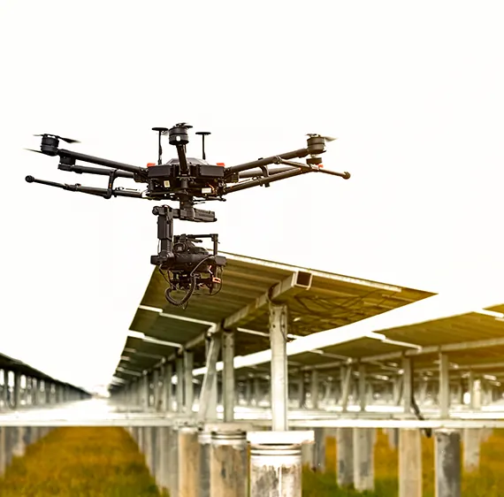 Drone inspecting a solar panel array.