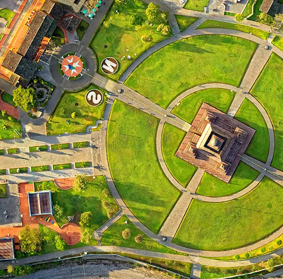 Aerial view of pristinely landscaped college campus park.
